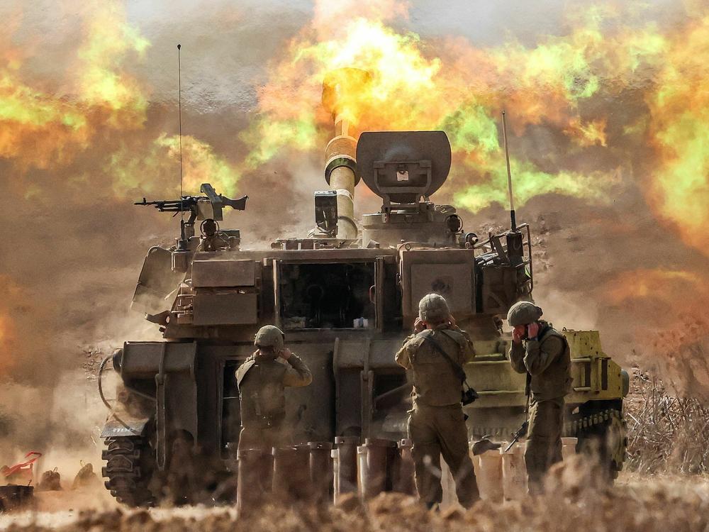 An Israeli army self-propelled howitzer fires rounds near the border with Gaza in southern Israel on Wednesday.