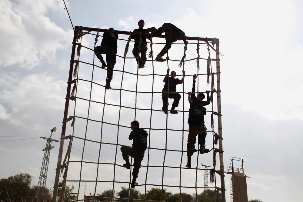 Palestinians take part in training organized by Hamas in the southern Gaza Strip town of Rafah on Jan. 11, 2014.