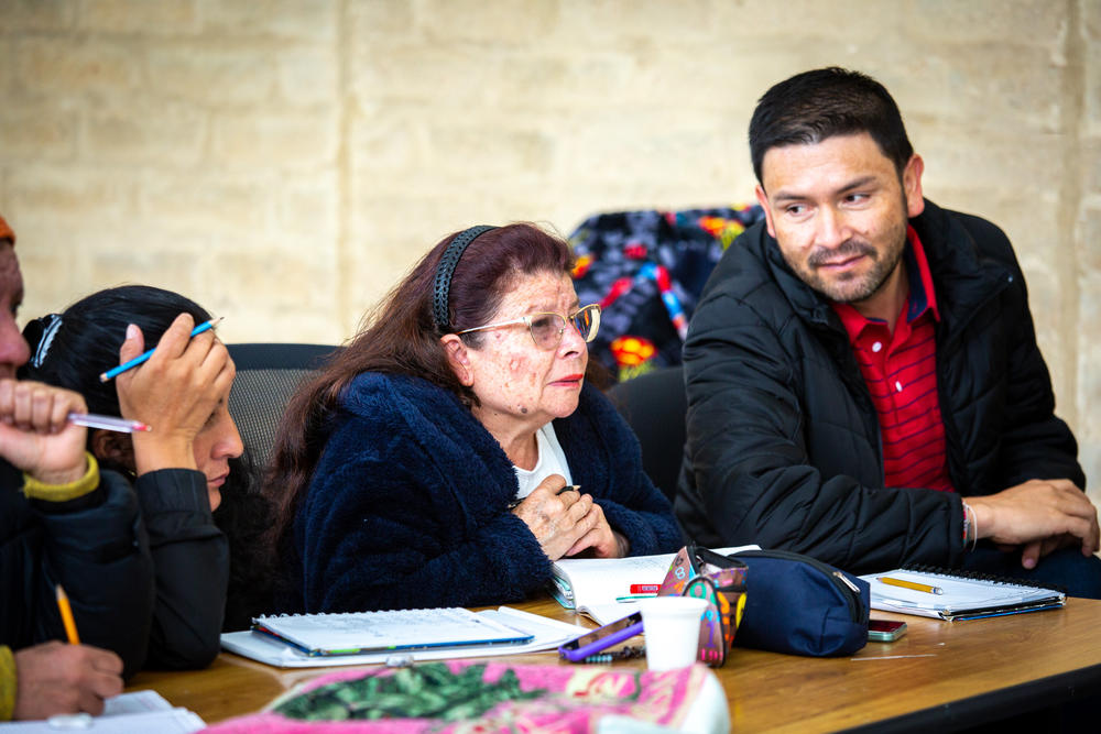 Salamanca focuses on a math problem that her teacher, right, posed during class.