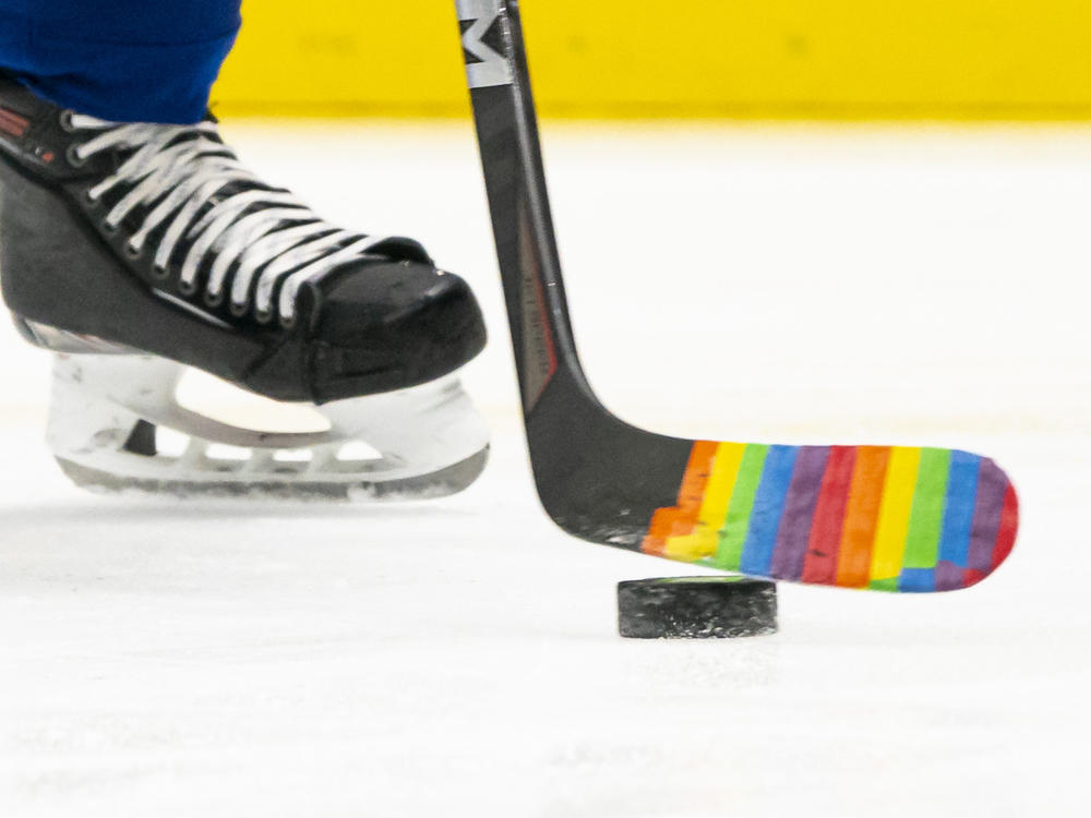 Pride Tape was quickly adopted by NHL teams as a way to support and celebrate LGBTQ+ fans and athletes. But the NHL has banned the tape. Here, a player used the tape on their stick for a pre-game warm up to celebrate a 