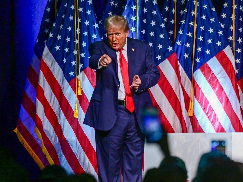 Former president and 2024 Republican presidential hopeful Donald Trump gestures during a campaign event in West Palm Beach, Fla., on Oct. 11. He did not appear in nearby Fort Pierce for a court hearing the next day.