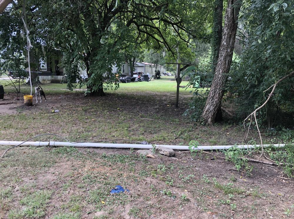 Like many of her neighbors in Hicks Hill, Ala., Gladys Maull straight pipes raw sewage from her mobile home to a pasture out back. Maull says nobody talked about the problem for fear of prosecution.