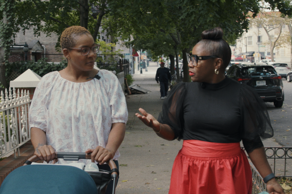 In this still from <em>The Big Idea: Birth Without Bias,</em> Kimberly Seals Allers reconnects with Adanna Atwell-Diallo, a mother who credits Irth's resources for helping her through pregnancy, birth and postpartum.