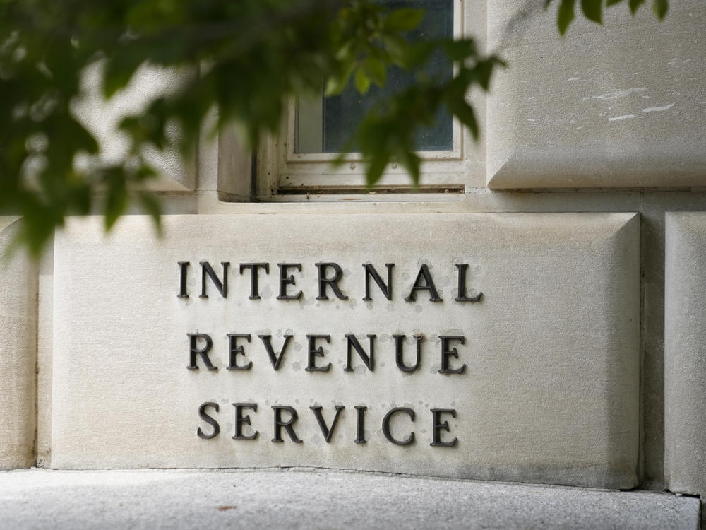 A sign outside the Internal Revenue Service building is seen, May 4, 2021, in Washington. The amount of tax money owed but not paid to the IRS is set to keep growing, according to projections published by the federal tax collection agency.