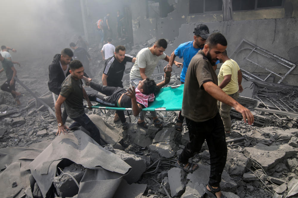 After Israeli air strikes on Rafah, Gaza, on Oct. 12, an injured man is carried out from the rubble.