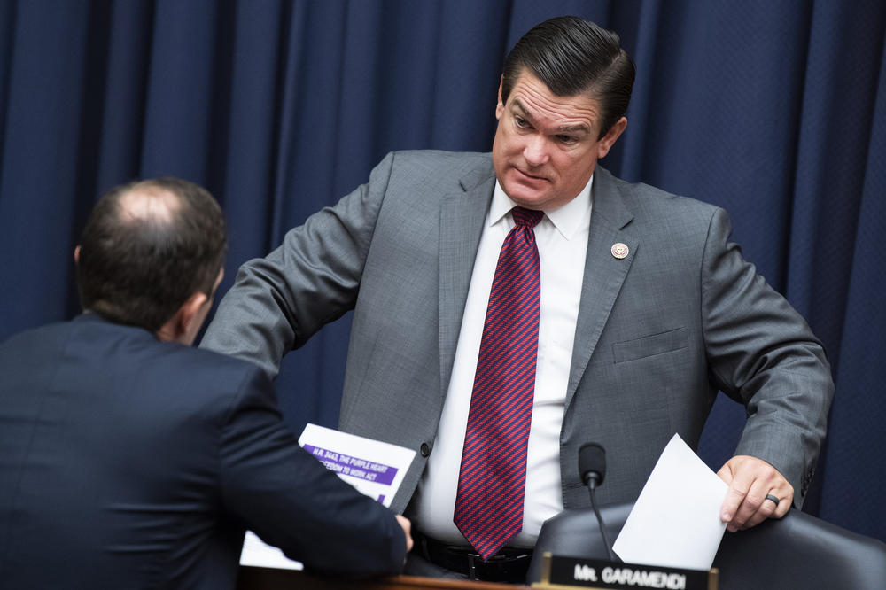 Rep. Austin Scott, R-Ga., (right) and Rep. Jason Crow, D-Colo., talk during a break in a House committee hearing in 2021. On Friday, Scott announced his candidacy for House speaker nominee but was later defeated by Rep. Jim Jordan in House GOP meeting.