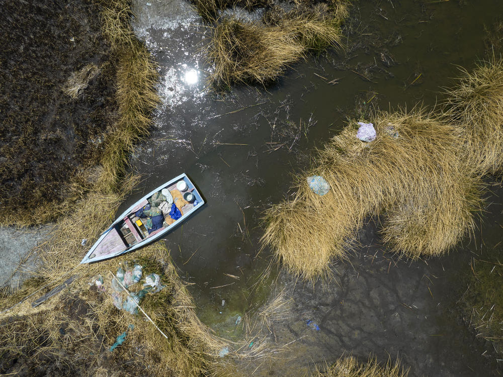 An aerial view of a stuck boat on a dried out lake in Bolivia. A new report finds that September 2023 was the hottest September on record. South America - which is coming out of its winter - also saw record high temperatures.