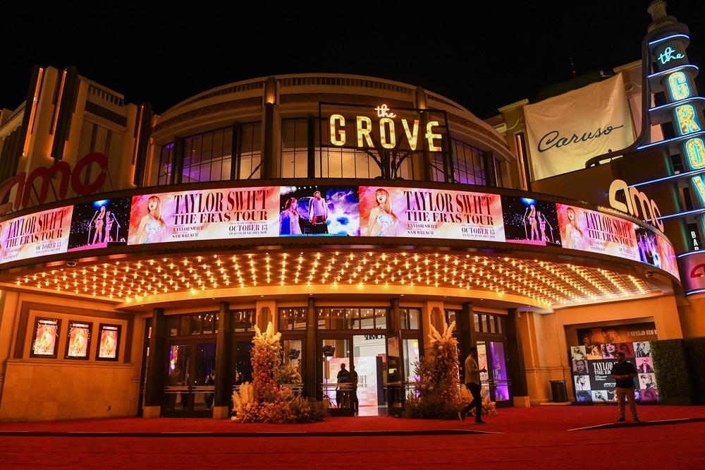 <em>Taylor Swift: The Eras Tour</em> is wildly entertaining but it is also a curious product that speaks to the larger themes of our IP-based age of content — recycled, reused and repackaged spin-offs. Above, AMC The Grove in Los Angeles, Calif., ahead of the film's world premiere on Oct. 11, 2023.