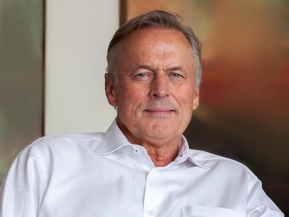 John Grisham at his office in Charlottesville, Va. His new book is a sequel to <em>The Firm</em>, the book that turned him into a star.