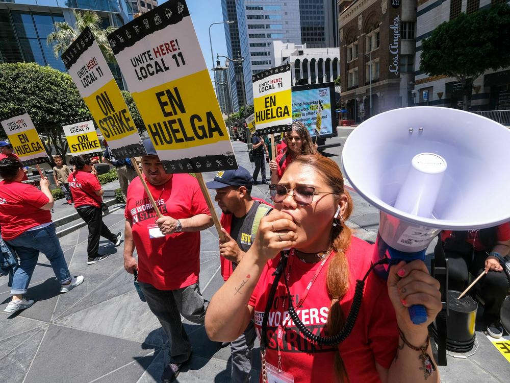 Striking hotel workers walk the picket line in Los Angeles, California, on July 2, 2023.