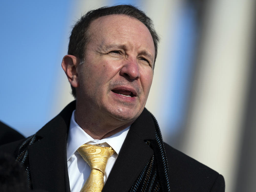 FILE - Louisiana Attorney General Jeff Landry talks to reporters outside the Supreme Court, Jan. 7, 2022, in Washington.