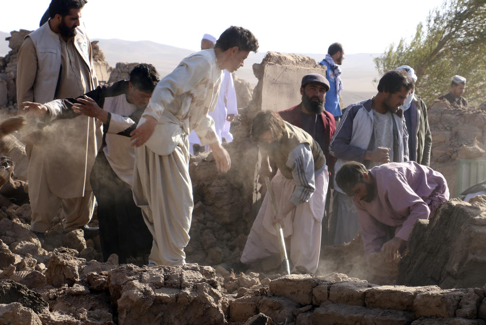 Sun., Oct. 8: Afghan men search for victims after an earthquake in Zenda Jan district in Herat province, of western Afghanistan