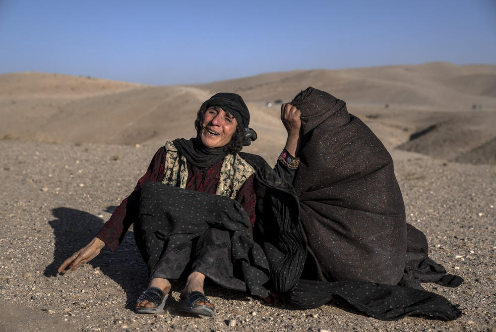 Sun., Oct. 8: Afghan women mourn relatives killed in an earthquake at a burial site after an earthquake in Zenda Jan district in Herat province.