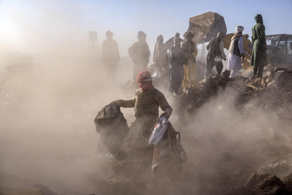 Mon., Oct. 9: Afghan men search for victims after an earthquake in Zenda Jan district in Herat.
