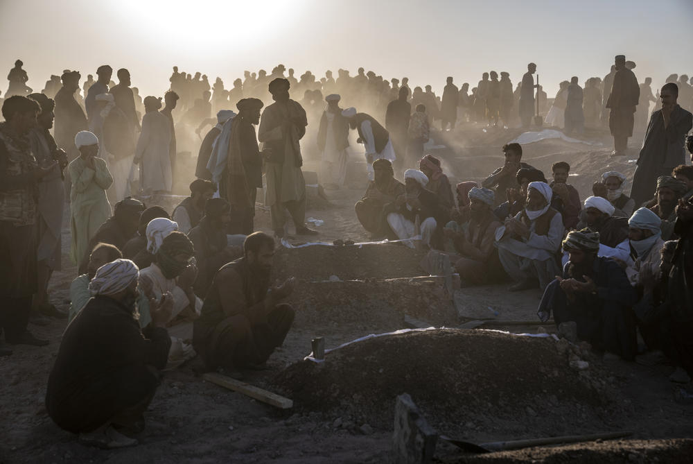 Mon., Oct. 9: Afghans bury hundreds of people killed in an earthquake to a burial site, in a village in Zenda Jan district in Herat.