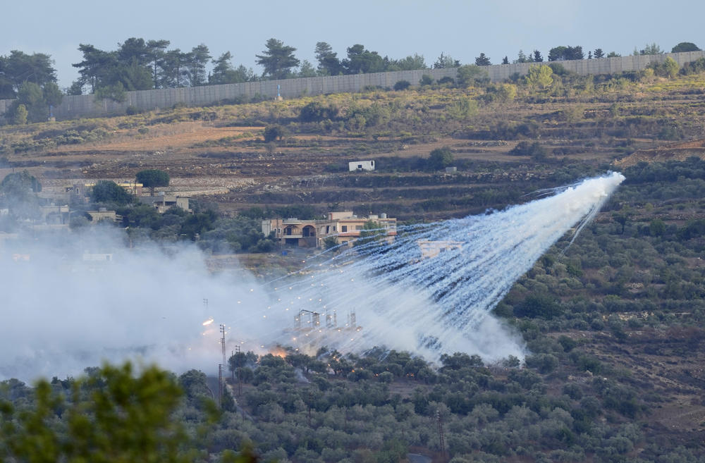 Sun. Oct. 15: A shell from Israeli artillery explodes over a house in al-Bustan, a Lebanese border village with Israel, south Lebanon.