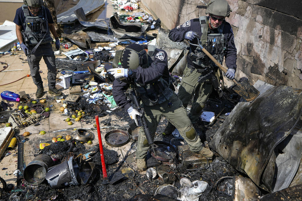 Sun., Oct. 15: Israeli police extinguish a fire at a site struck by a rocket from the Gaza Strip, in the town of Sderot, southern Israel.