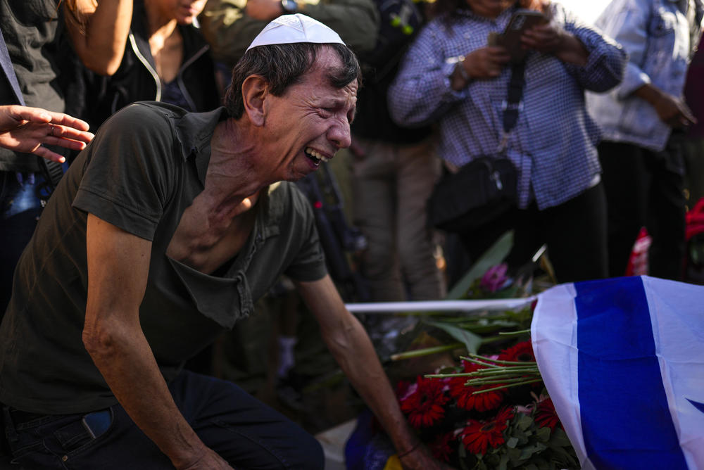 Sun., Oct. 15: A man mourns during the funeral of Antonio Macias, killed by Hamas militants while attending a music festival in southern Israel, at Pardes Haim cemetery in Kfar Saba, Israel.