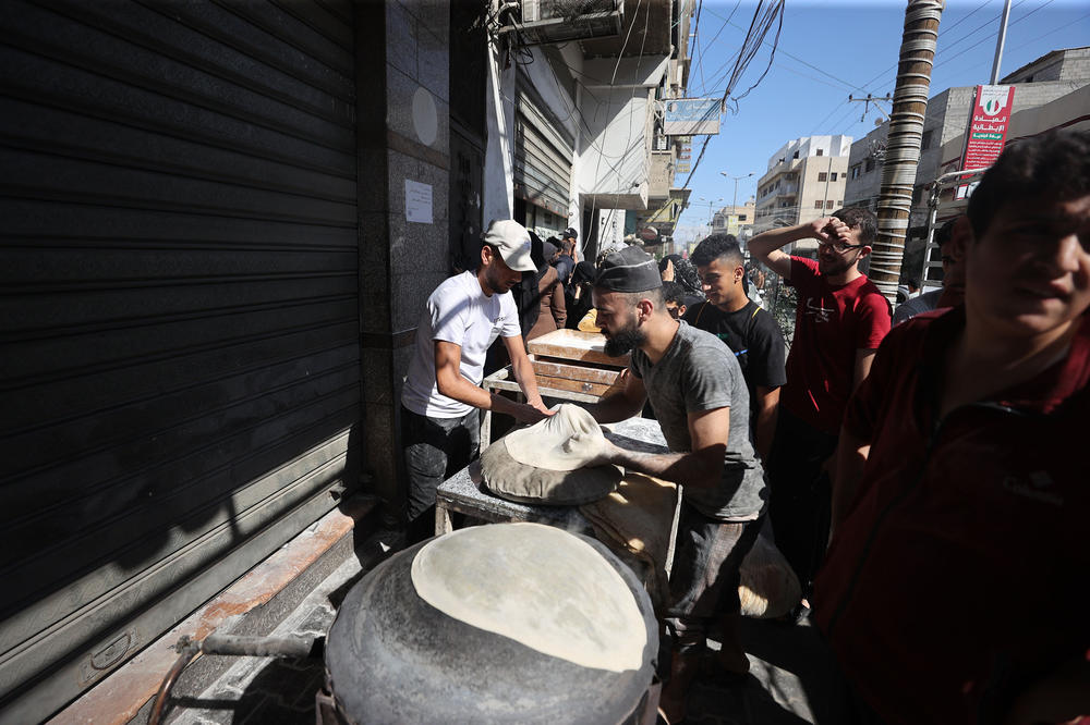 Sun., Oct. 15: Palestinians line up in front of a bakery to buy bread after Israel restricts the area of basic services such as water, electricity, and food in Khan Yunis, Gaza.