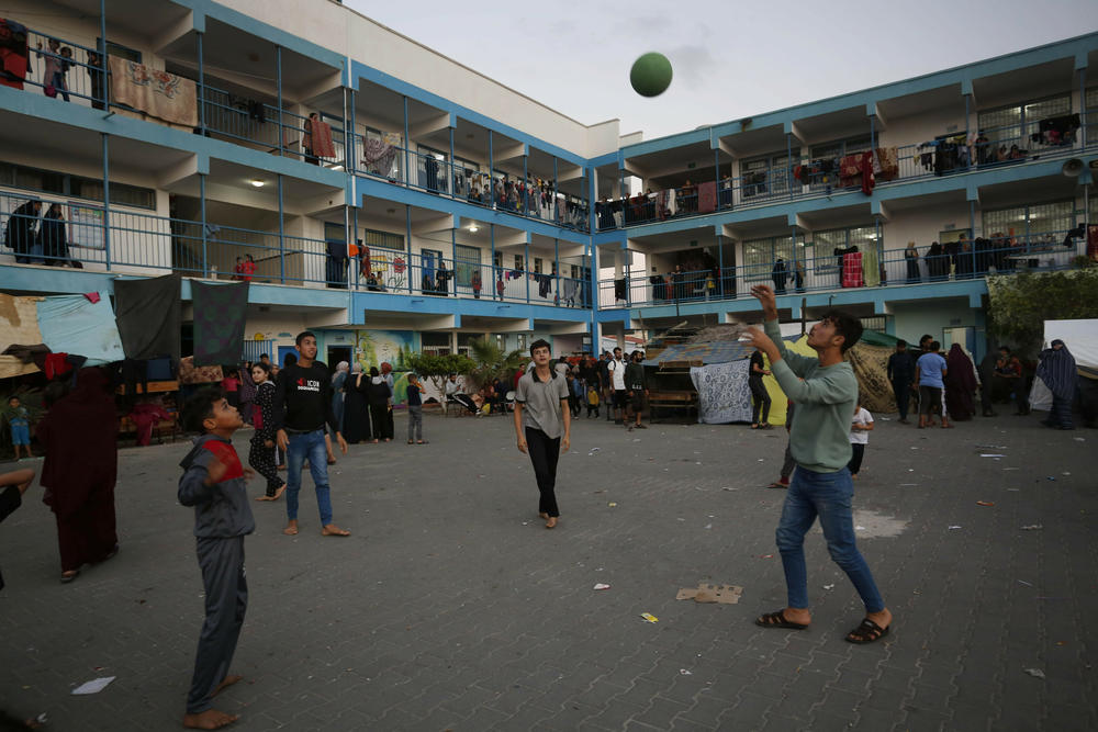 Sun., Oct. 15: Palestinians take shelter in a UN school as Israeli attacks on Gaza continue on the 9th day, in Deir al Balah, Gaza.