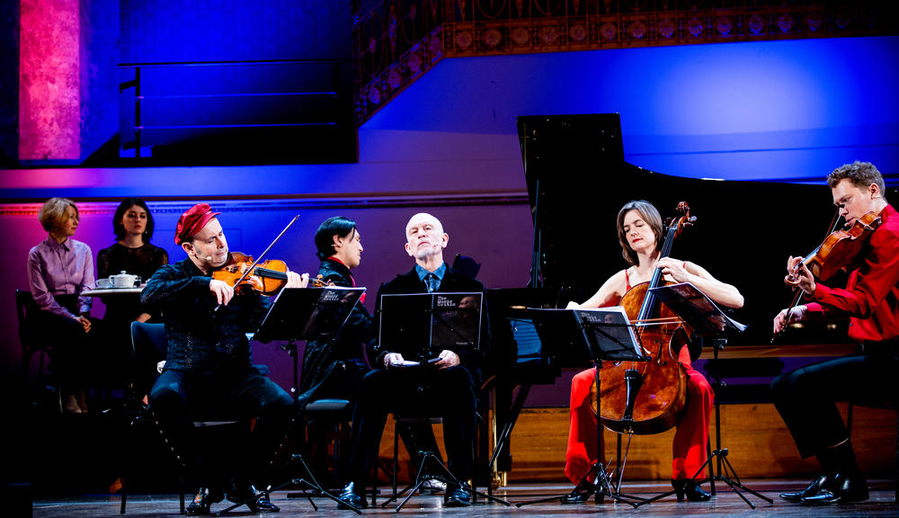 The cast of <em>The Music Critic</em>, starring John Malkovich (center) as the critic.