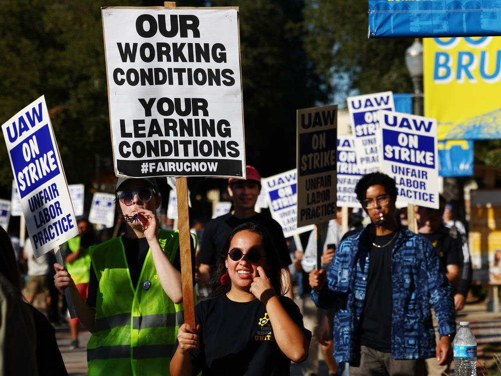 Union academic workers and supporters march and picket at the UCLA campus amid a statewide strike by nearly 48,000 University of California unionized workers on Nov. 15, 2022, in Los Angeles.