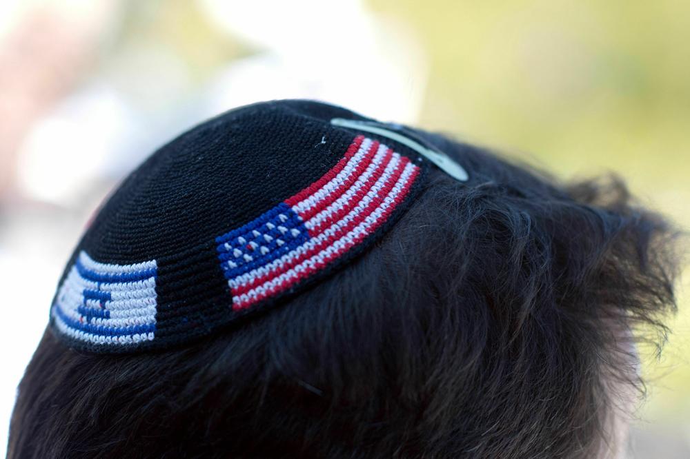 A demonstrator wears a yarmulke embroidered with the flags of Israel and the United States during a rally in support of Israel outside the Colorado State Capitol Building in Denver on Sunday.