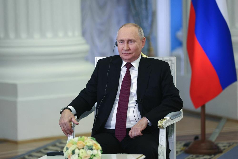 This pool photograph distributed by Russian state-owned agency Sputnik shows Russia's President Vladimir Putin giving an interview to China Media Group at the Kremlin in Moscow on Monday.