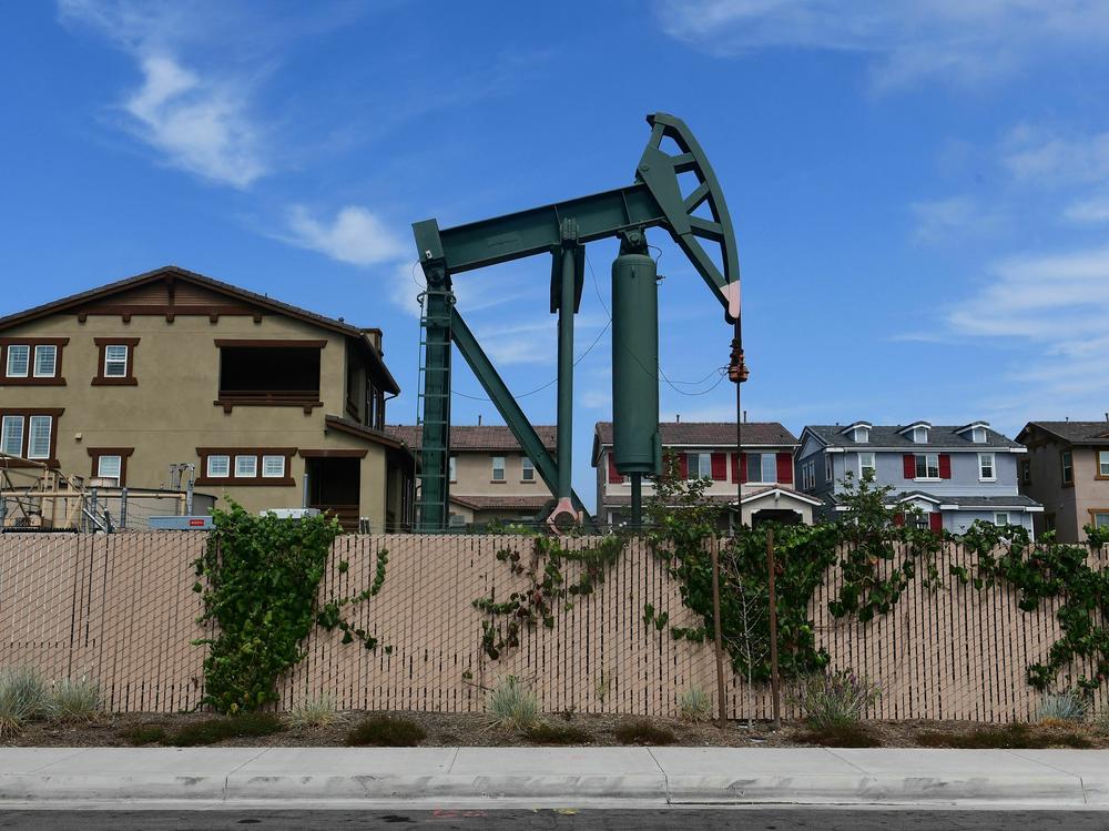 Hundreds of active oil wells sit in densely populated and mostly low-income neighborhoods in Los Angeles. A new report details why equity should be central to climate and energy policy in the U.S. to address historical practices.