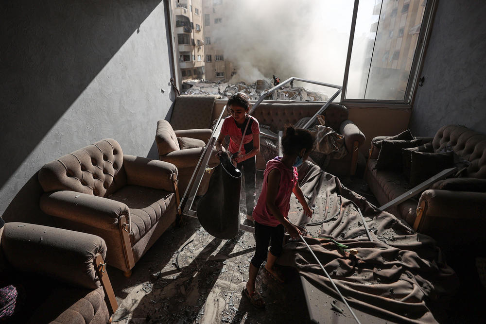 Children are seen in a destroyed house after Israeli attacks in Gaza City.