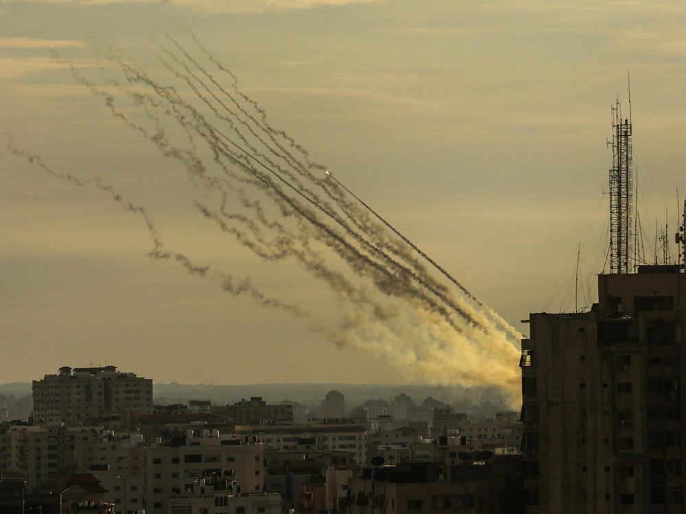 Palestinian militants fire rockets into Israel from Gaza Strip, Oct. 7.