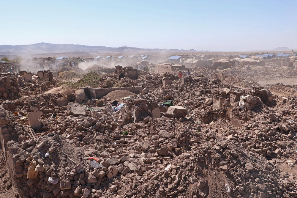 The scene after a series of earthquakes in the Zendeh Jan district of Herat province on Oct. 9, as volunteers look for survivors and dead bodies. Some Afghan aid specialists say Taliban recovery efforts have been inadequate.