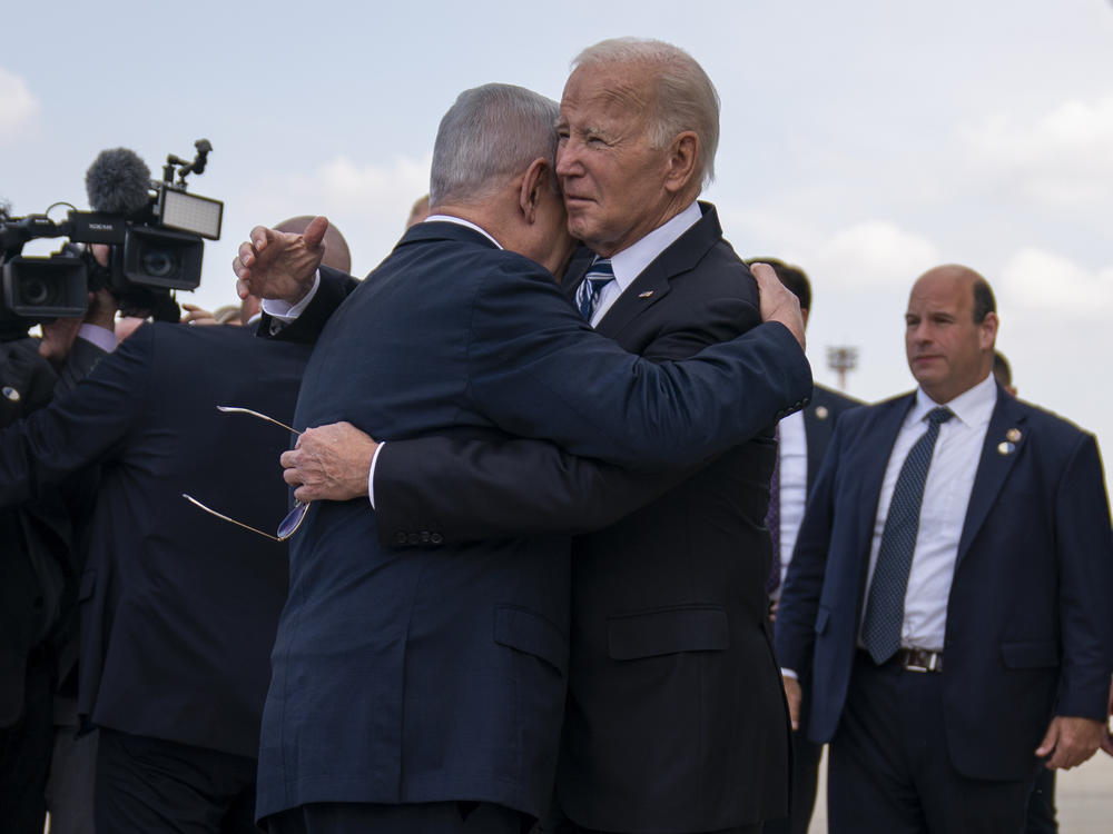 President Biden hugs Israeli Prime Minister Benjamin Netanyahu after arriving at Ben Gurion International Airport, Wednesday in Tel Aviv.