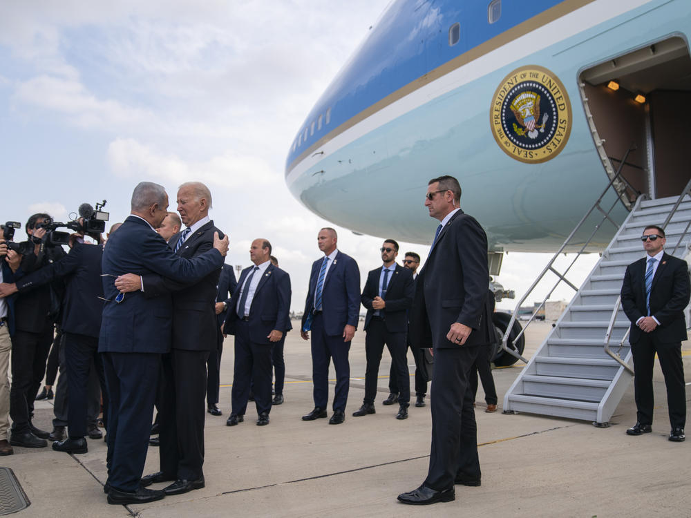President Biden is greeted by Israeli Prime Minister Benjamin Netanyahu after arriving at Ben Gurion International Airport, Wednesday in Tel Aviv.