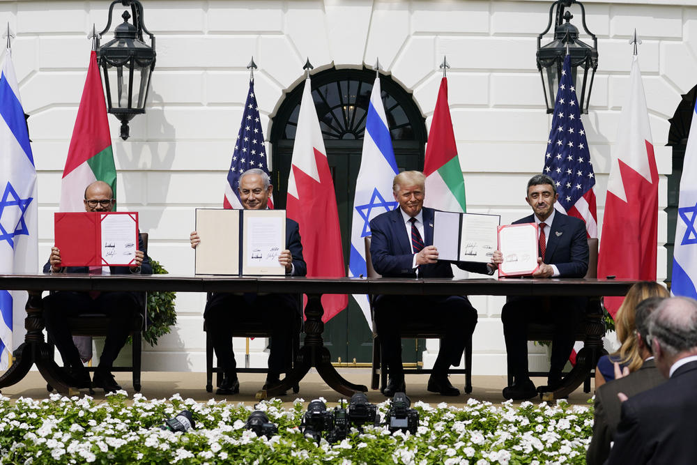 President Donald Trump with, from left, Bahrain Foreign Minister Khalid bin Ahmed Al Khalifa, Israeli Prime Minister Benjamin Netanyahu, Trump, and United Arab Emirates Foreign Minister Abdullah bin Zayed al-Nahyan, during the Abraham Accords signing ceremony on the South Lawn of the White House, on Sept. 15, 2020.