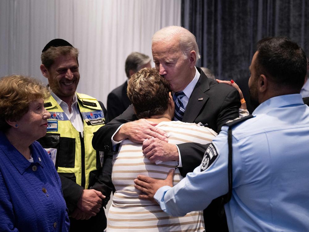 President Biden hugs Rachel Edri, who was held hostage by Hamas, during his trip to Tel Aviv. Biden met with people who had witnessed the horrors of the Oct. 7 Hamas attack on Israel.