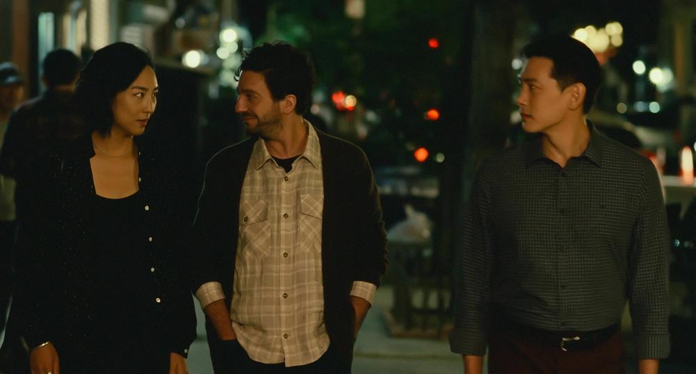 Actors John Magaro and Teo Yoo (shown here with Greta Lee) met for the first time in the scene they shared in <em>Past Lives.</em>