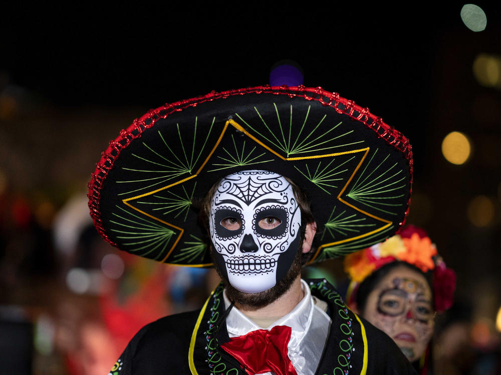 A Halloween reveler participates in New York City's 48th annual Greenwich Village Halloween Parade, Sunday, Oct. 31, 2021, in New York.