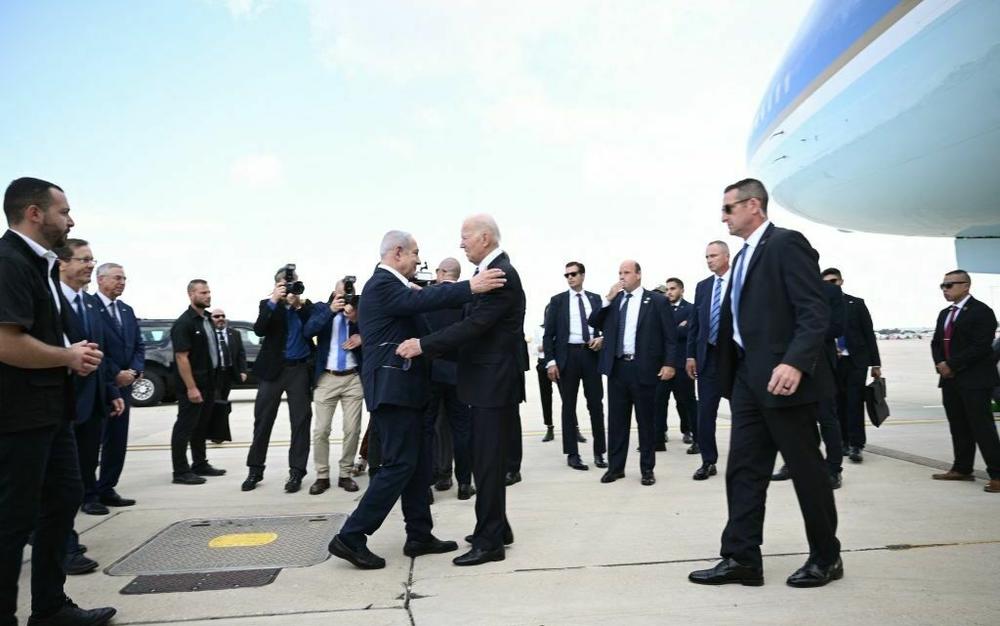 Israel Prime Minister Benjamin Netanyahu greets President Biden upon his arrival at Tel Aviv's Ben Gurion airport on Wednesday.