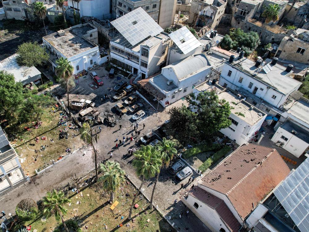 An aerial view of the complex housing the Ahli Arab hospital in Gaza City after an explosion on the hospital grounds that killed hundreds, according to Palestinian officials. Unraveling the facts behind the explosion has been made difficult because of swarms of social media accounts spreading false information about the explosion.