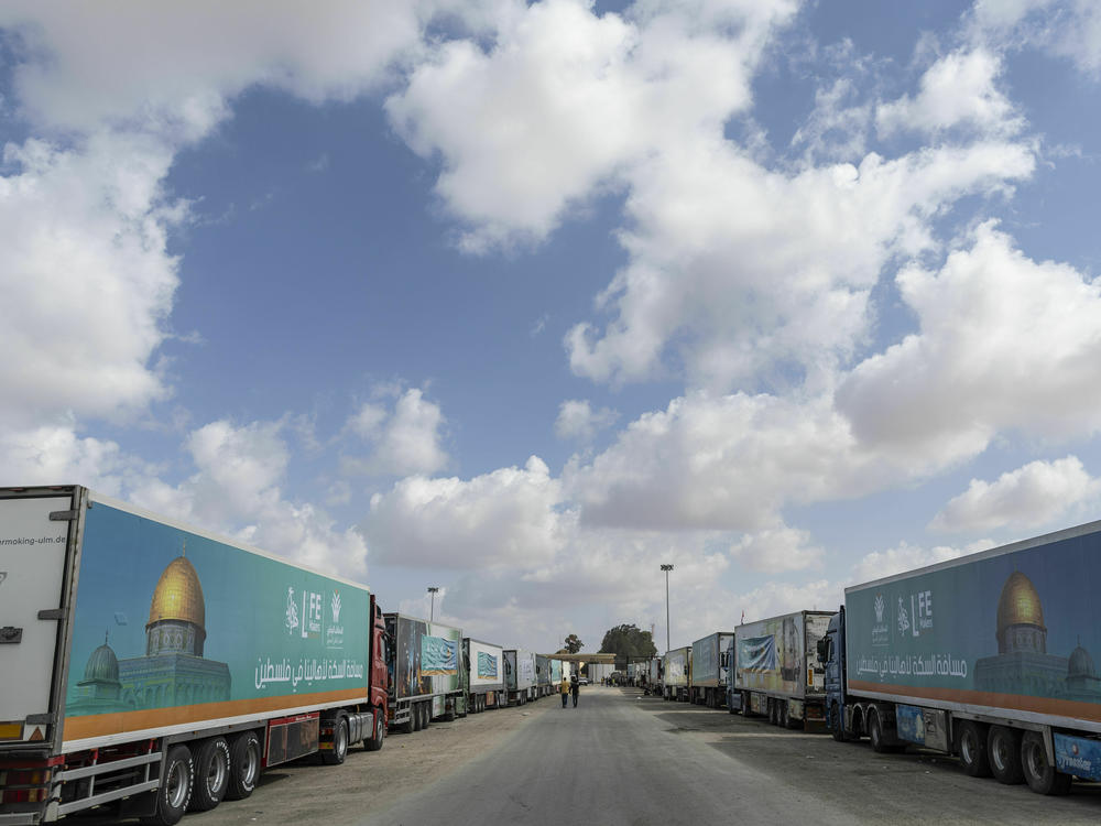 Aid convoy trucks wait at the Rafah border crossing for clearance to enter Gaza on Thursday in North Sinai, Egypt. The aid convoy, organized by a group of Egyptian NGOs, set off Saturday from Cairo for the Gaza-Egypt border crossing at Rafah.