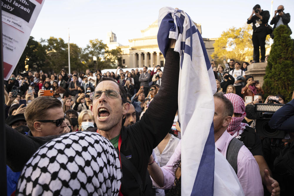 A pro-Israel demonstrator shouts at Palestinian supporters during a protest at Columbia University in New York on October 13.