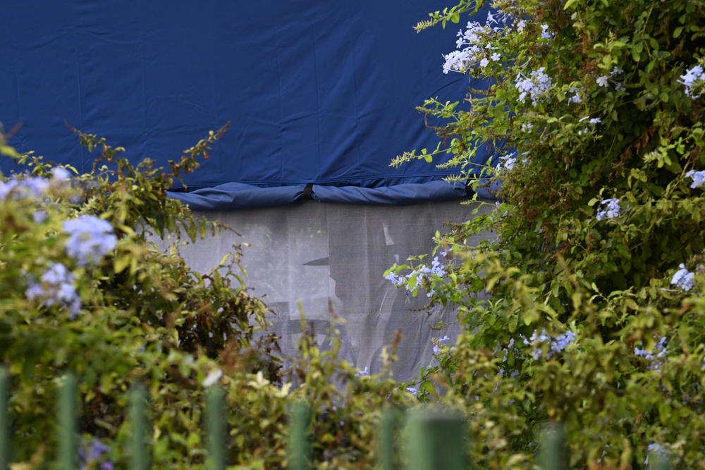 A man in tent holding shiva for Noy's brother in West Jerusalem, Israel.