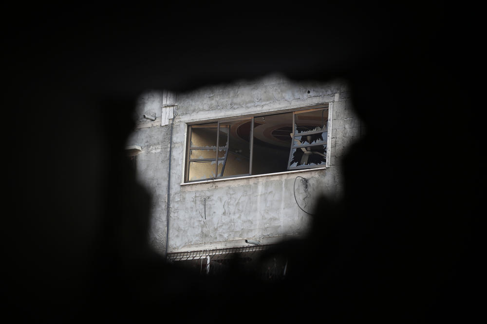 Palestinian citizens inspect damage to their homes caused by Israeli airstrikes on October 14, 2023 in Gaza City, Gaza.