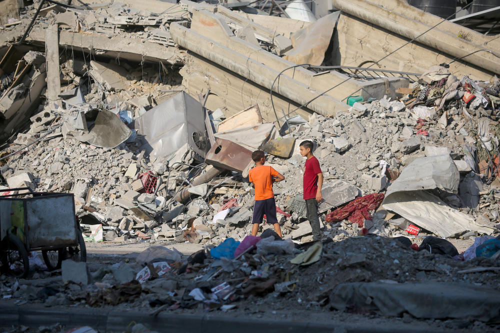 Palestinian citizens inspect damage to their homes caused by Israeli airstrikes on October 14, 2023 in Gaza City, Gaza.