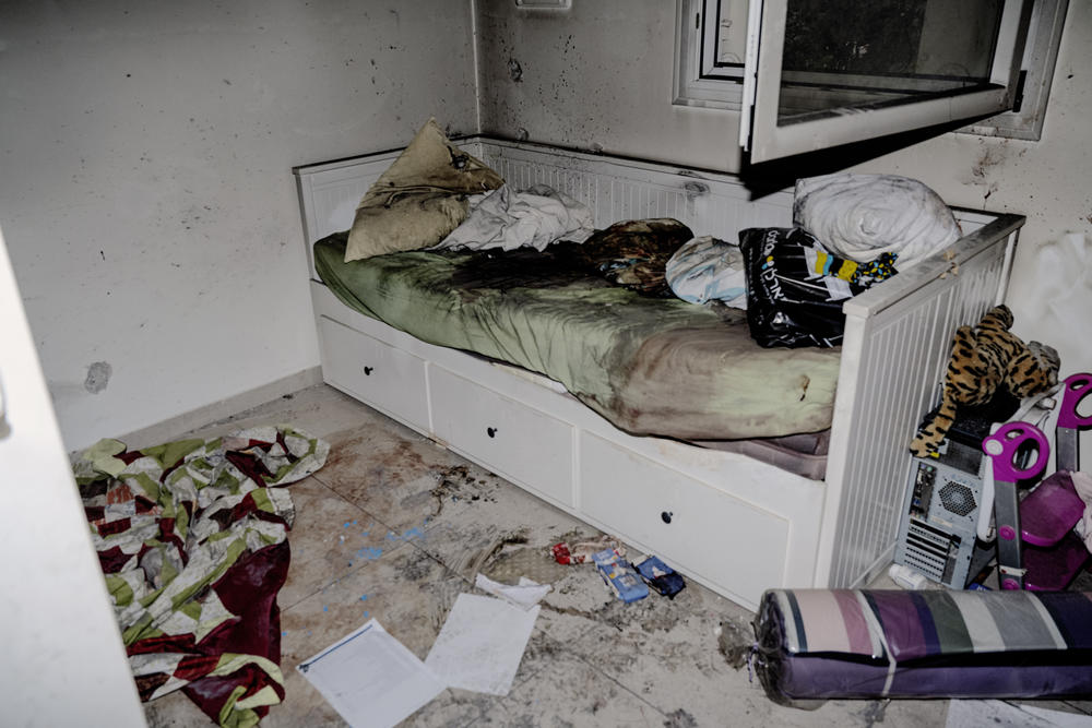 A mattress covered in blood in a child's bedroom.