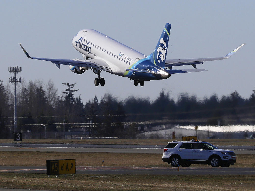 An Alaska Airlines Embraer 175 jet, similar to this one, was forced to make an unexpected landing Sunday night after an off-duty pilot who was riding in the cockpit allegedly attempted to disable the aircraft's engines.