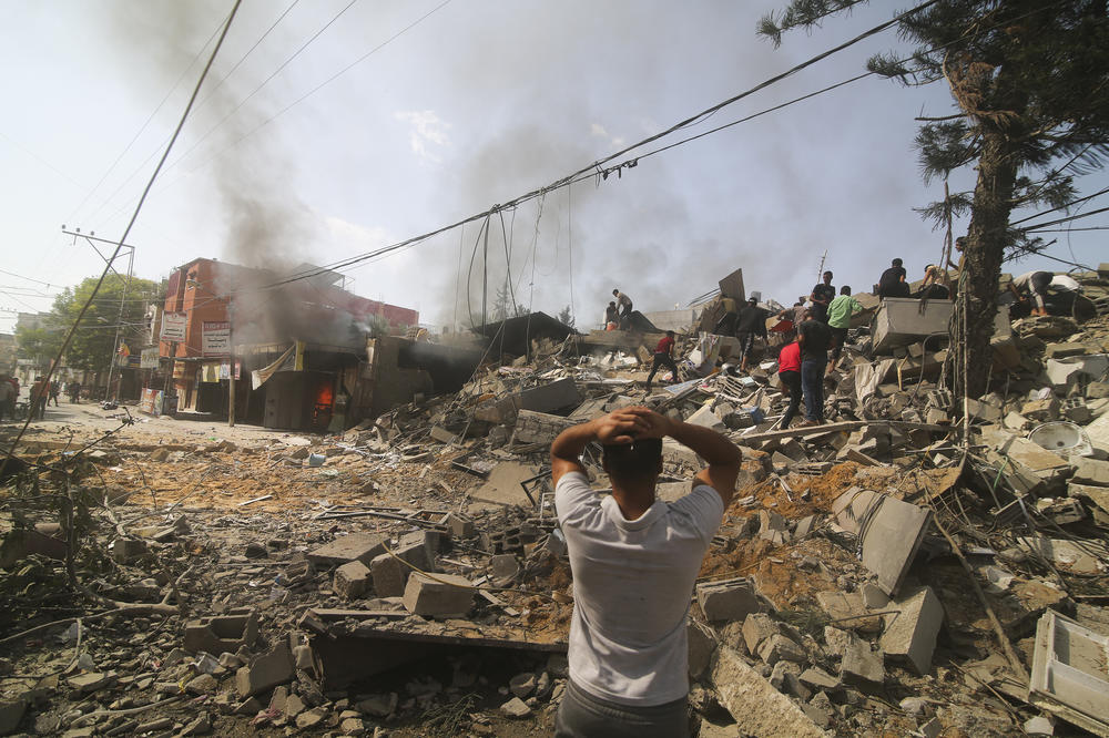 Palestinians look for survivors of the Israeli bombardment of the Gaza Strip in Rafah on Monday.
