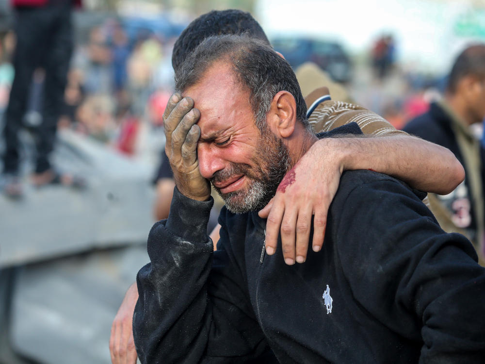 A man cries because his home was bombed during Israeli air raids in the southern Gaza Strip on October 16, 2023 in Khan Yunis, Gaza.