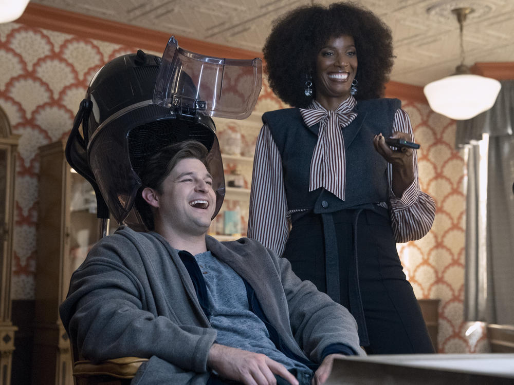 Zainab Johnson as Aleesha and Kevin Bigley as Luke in the sci-fi comedy <em>Upload</em>.